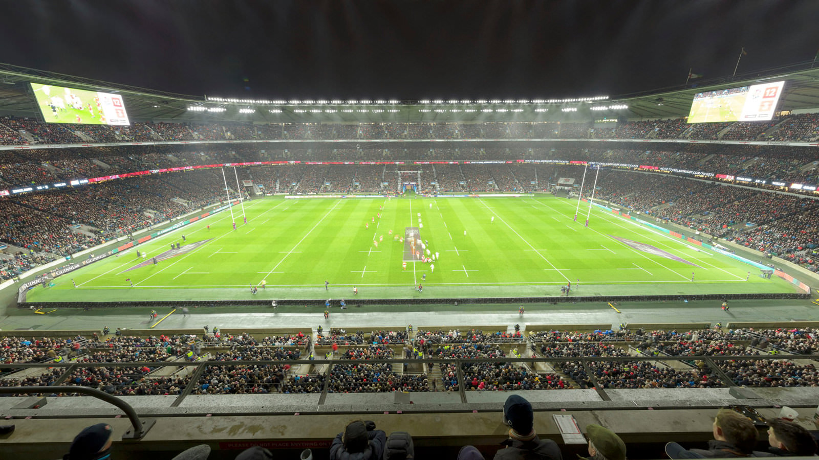 Stadium 360 at Twickenham stadium - shows the floodlit pitch during a Six Nations game with the pitch floodlit and the sky dark.
