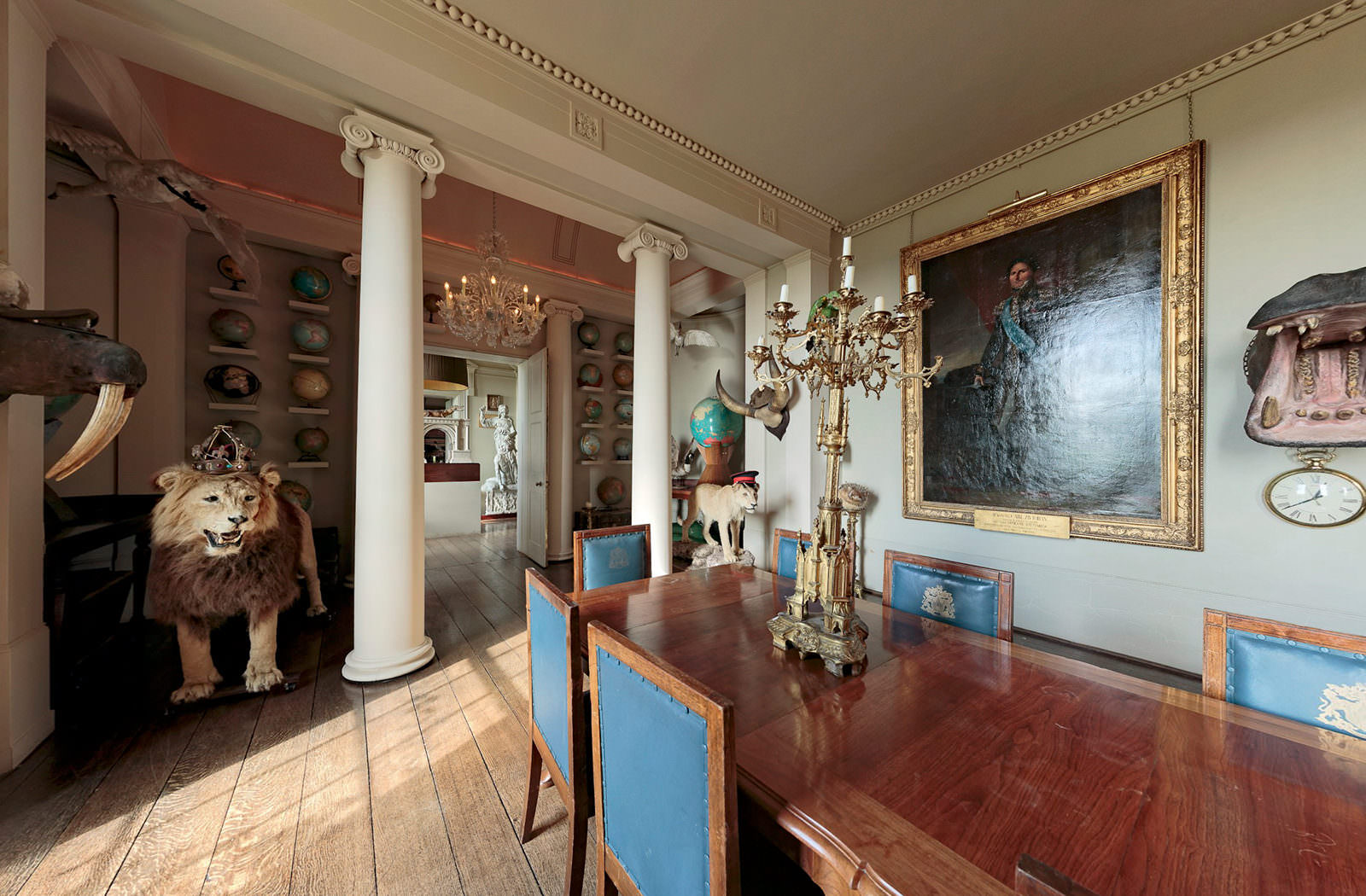 Still of the room with a taxidermy lion at Aynhoe Park