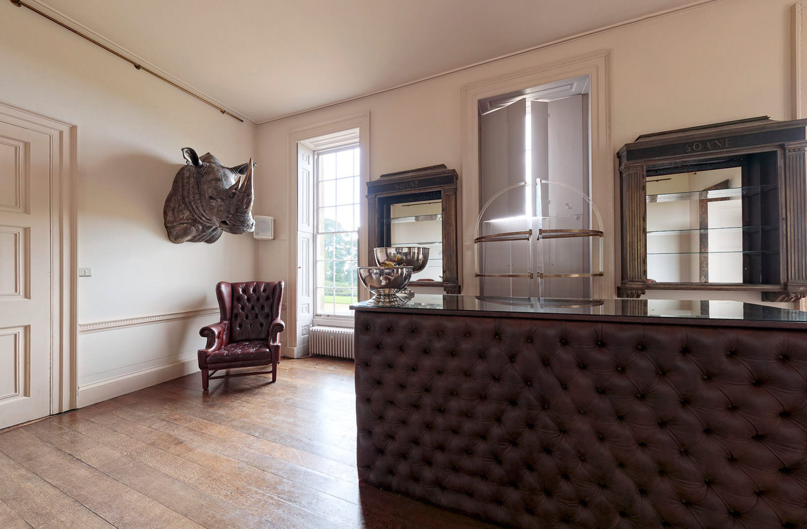Still of the bar with rhino head taxidermy