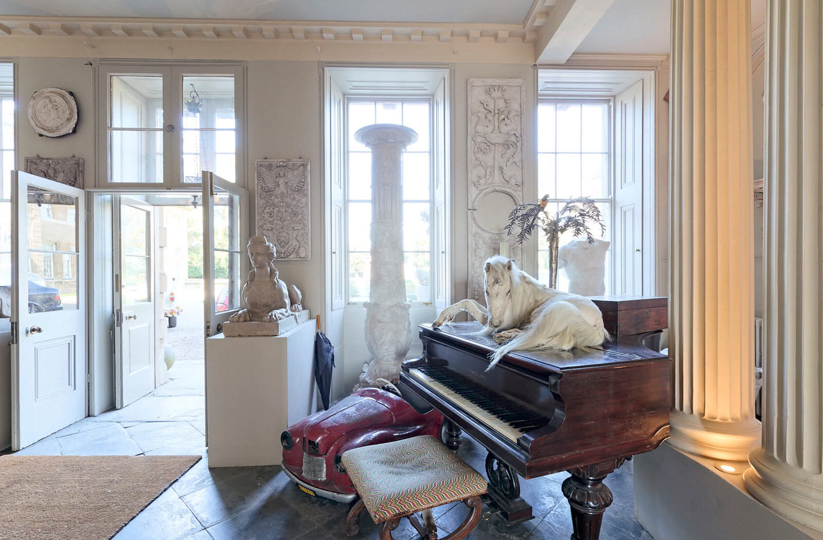 Aynhoe Park - still of the taxidermy unicorn on the piano from the virtual tour