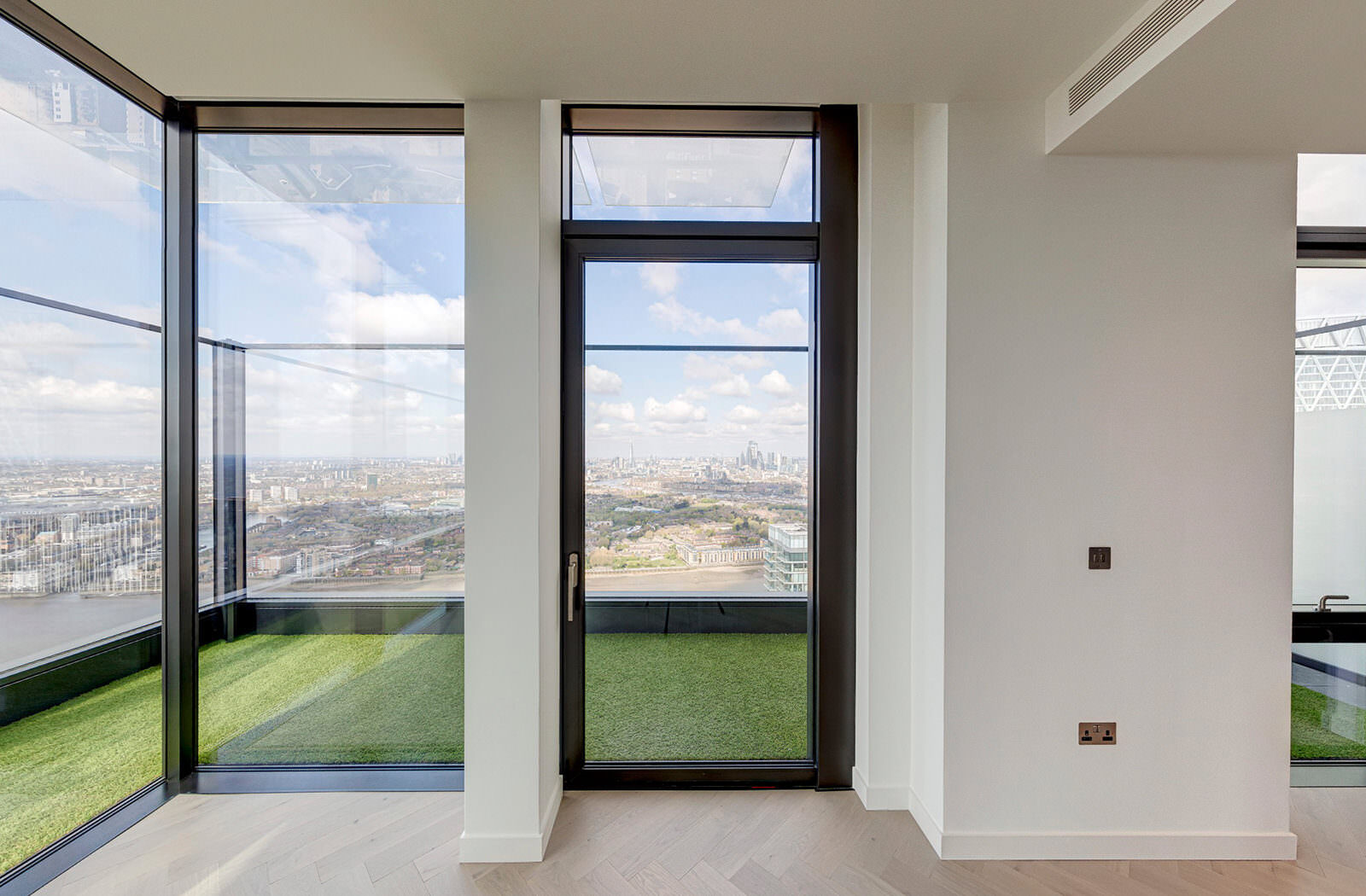Wardian 360 Tour - still from virtual tour of Wardian London showing cityscape views from a room overlooking London