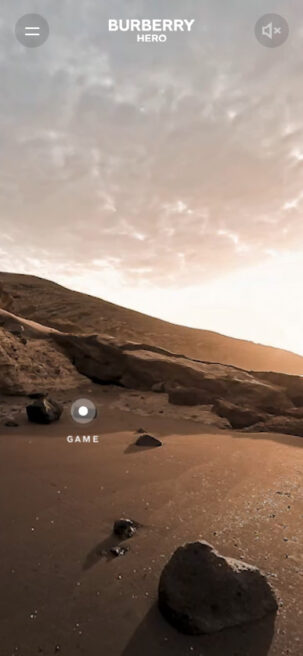 Screenshot from the Burberry 360 video campaign - shows a view on a black sand beach in Tenerife with long shadows from a bright sunset in the sky.