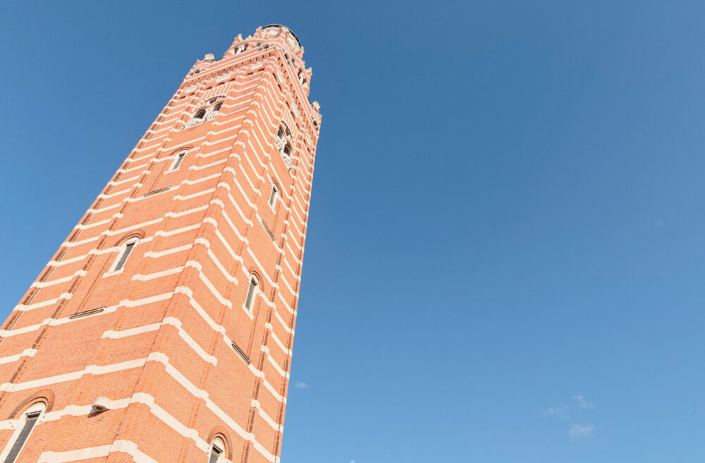 Westminster Cathedral virtual tour - a still from the cathedral virtual tour showing the exterior of the tower silhouetted against a bright blue summer sky.