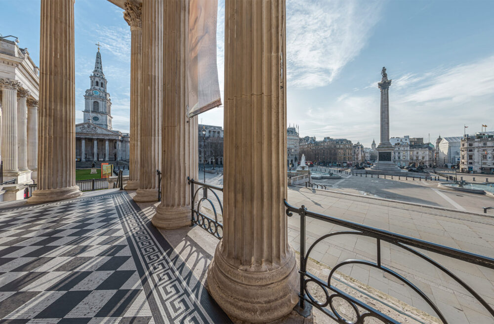 Still taken from the National gallery virtual tour showing the Portico Terrace at the National looking out over Trafalgar Square in sunlight