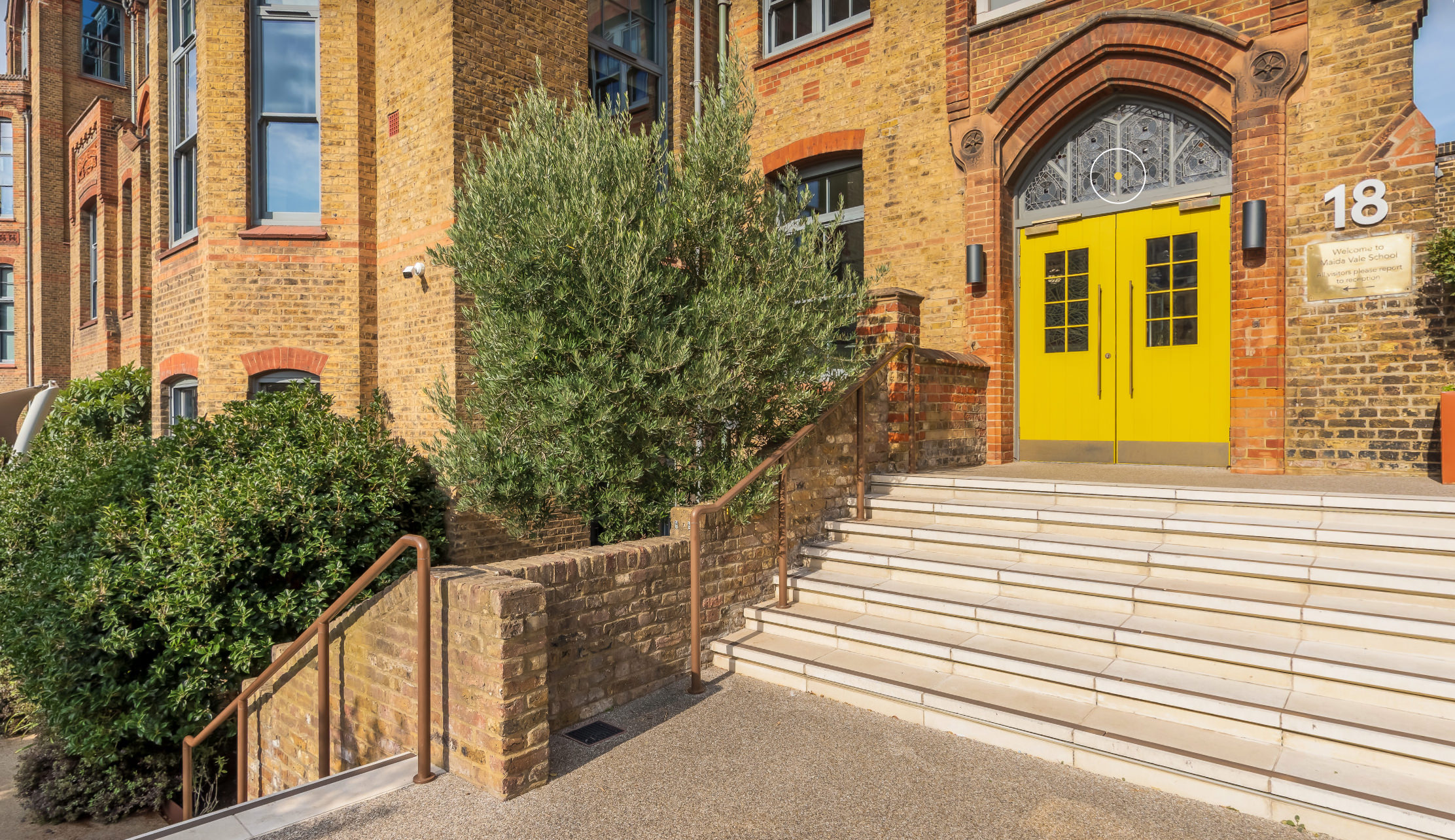 Still from'How to choose the right virtual tour company for your school' article. Still shows the front door of Maida Vale School in London.
